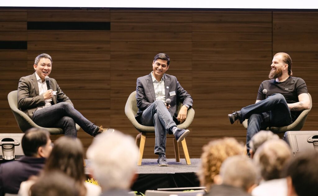 Vikram Malhi (center) at Wavemaker Partners Annual General Meeting 2025 with Xue Koh (Wavemaker Growth) and Martin Markiewicz (Silent Eight).